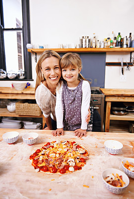 Buy stock photo Mom, girl and cooking pizza with portrait in kitchen with smile, learning and helping for development in home. Food, mother and daughter with dough, teaching and support with bonding in family house