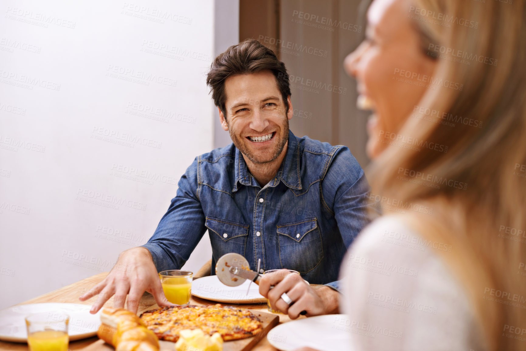 Buy stock photo Family, pizza and funny with happiness, home and bonding together with weekend break and cheerful. Man, woman and humor with laughing and dinner with food and meal with joy and fun in an apartment