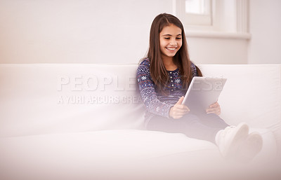 Buy stock photo Space, home or girl with tablet for elearning, playing games or streaming videos on a movie subscription. Education, online or happy child with technology to download on app or reading ebook on couch