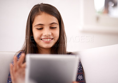 Buy stock photo Relax, couch or happy child with tablet for elearning, playing games or streaming videos on a movie website. Education, online and girl in home with technology to download on app or reading ebook