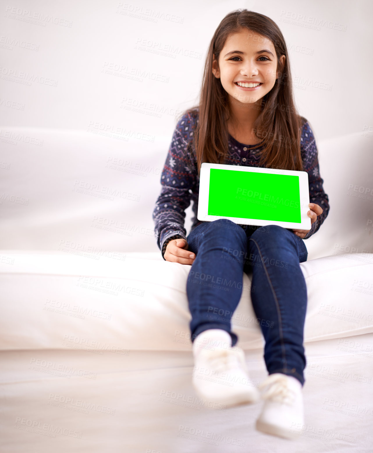 Buy stock photo Portrait, green screen or child with tablet for mockup, playing games or streaming videos on movie website. Space, house or happy kid with smile or technology to download on social media app on sofa