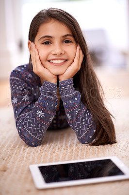 Buy stock photo Floor, portrait or kid with tablet for streaming, playing games or watching fun videos on movie website. Girl, house or happy child with technology to download online or social media app to relax