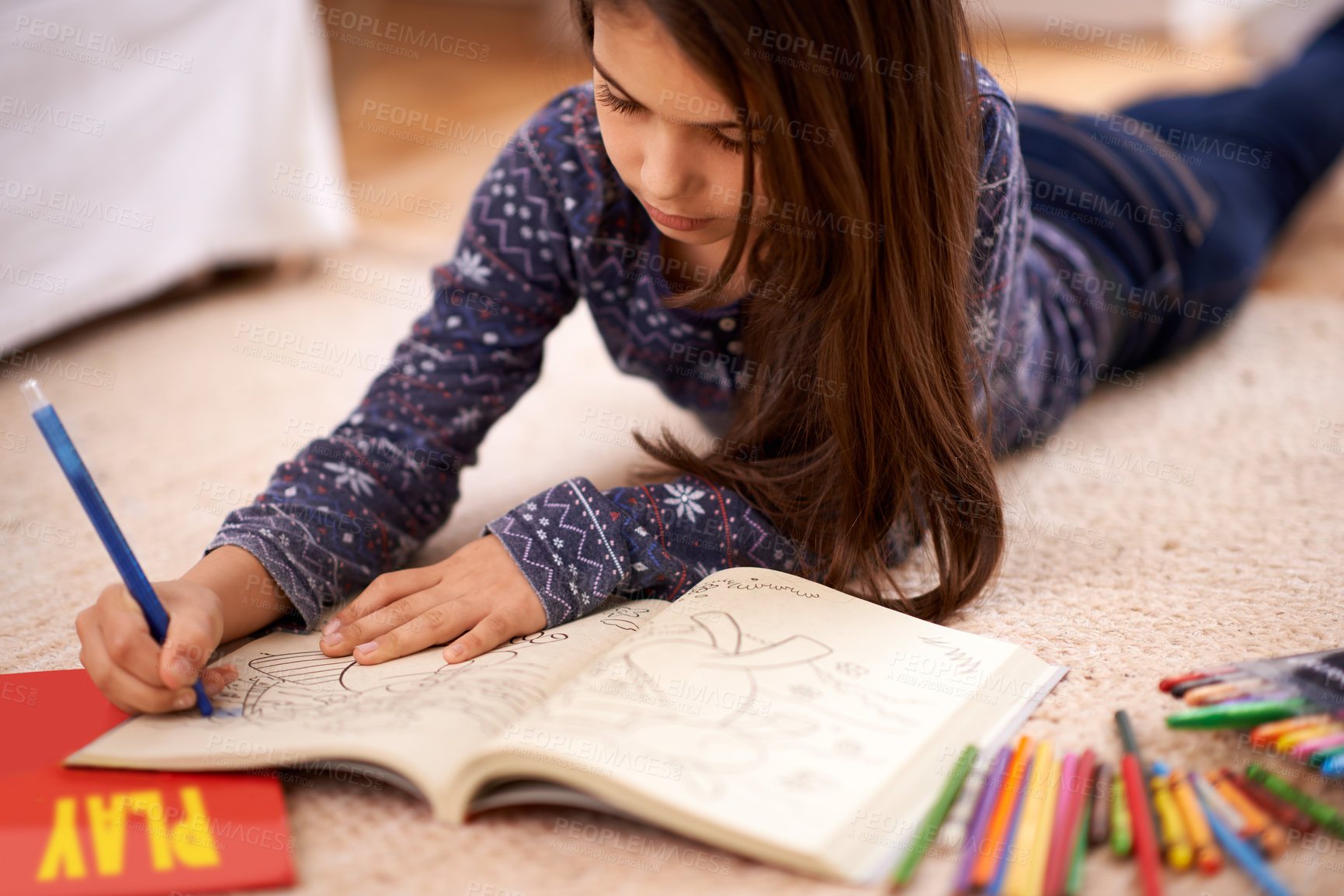 Buy stock photo Girl, child and coloring book on floor for drawing in home with learning, development or art in lounge. Kid, pencil and education for studying, creativity or relax on carpet at family house in Madrid