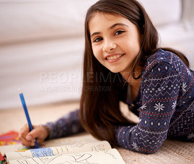 Buy stock photo Girl, coloring book and portrait on floor for drawing in home with learning, development and lying in lounge. Kid, art and smile for sketch, creativity and relax on carpet at family house in Madrid