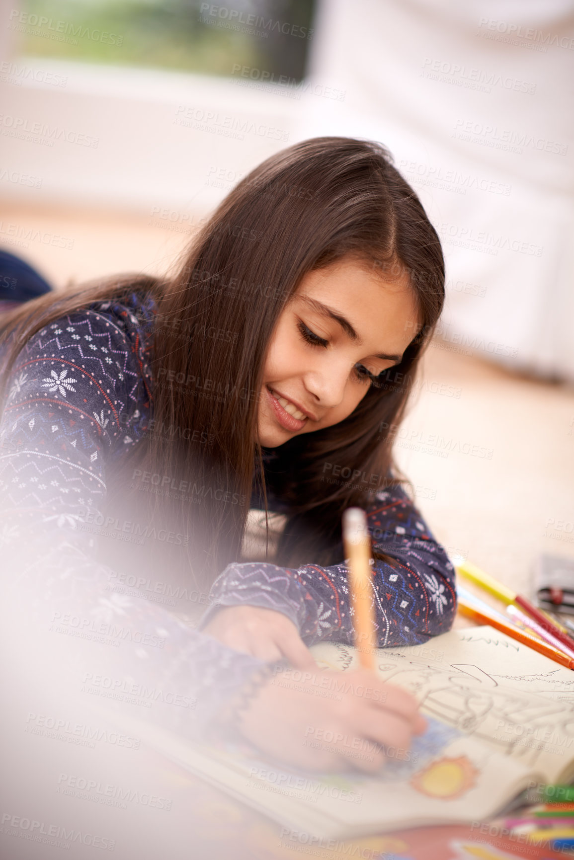 Buy stock photo Girl, coloring book and smile on floor for sketch in home for learning, development or drawing in lounge. Kid, art and education for studying, creativity or relax on carpet at family house in Madrid