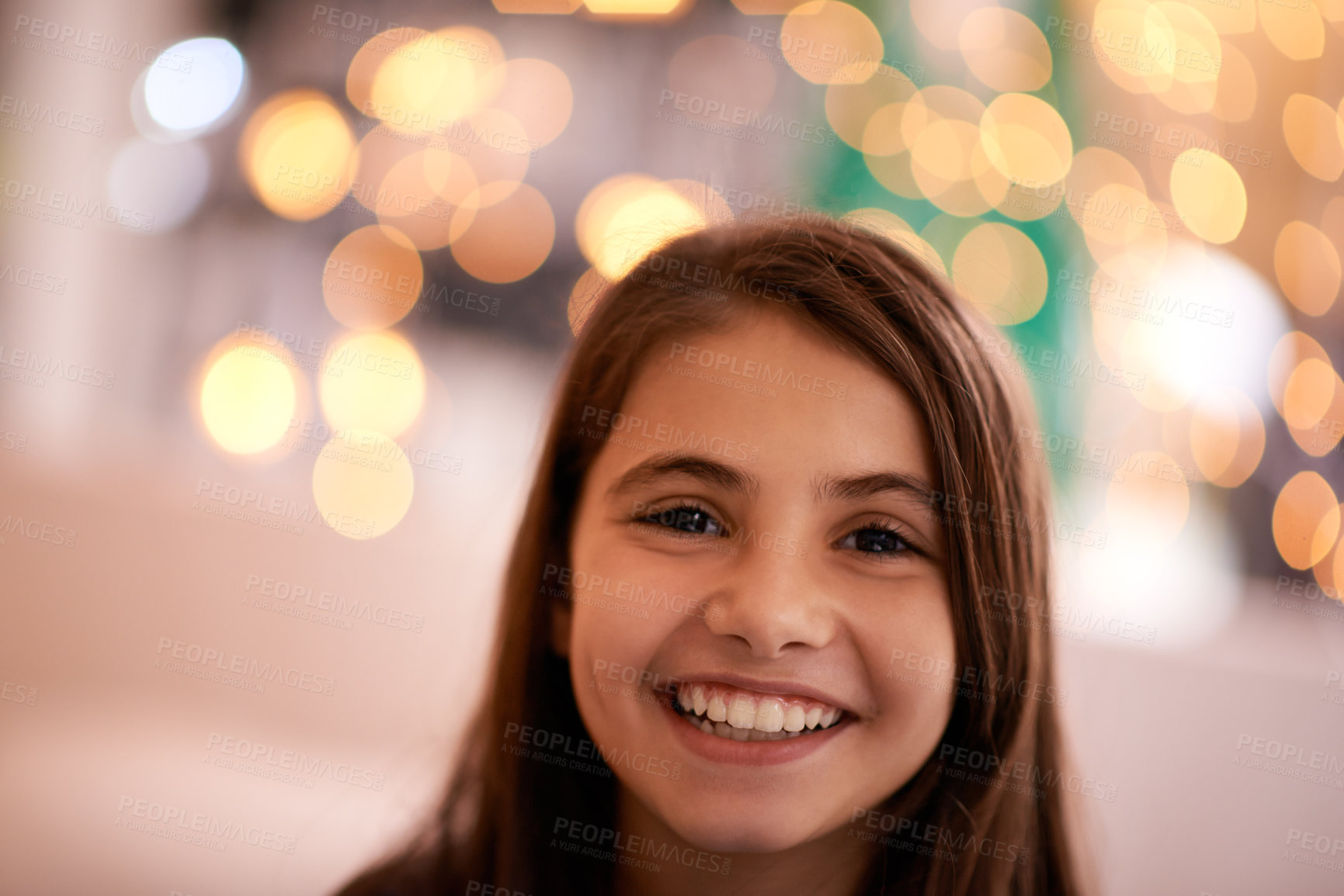 Buy stock photo Home, happy and portrait of child with in bedroom for relaxing, resting and calm at night. Youth, smile and face of young girl with fairy lights for childhood memories, positive and happiness