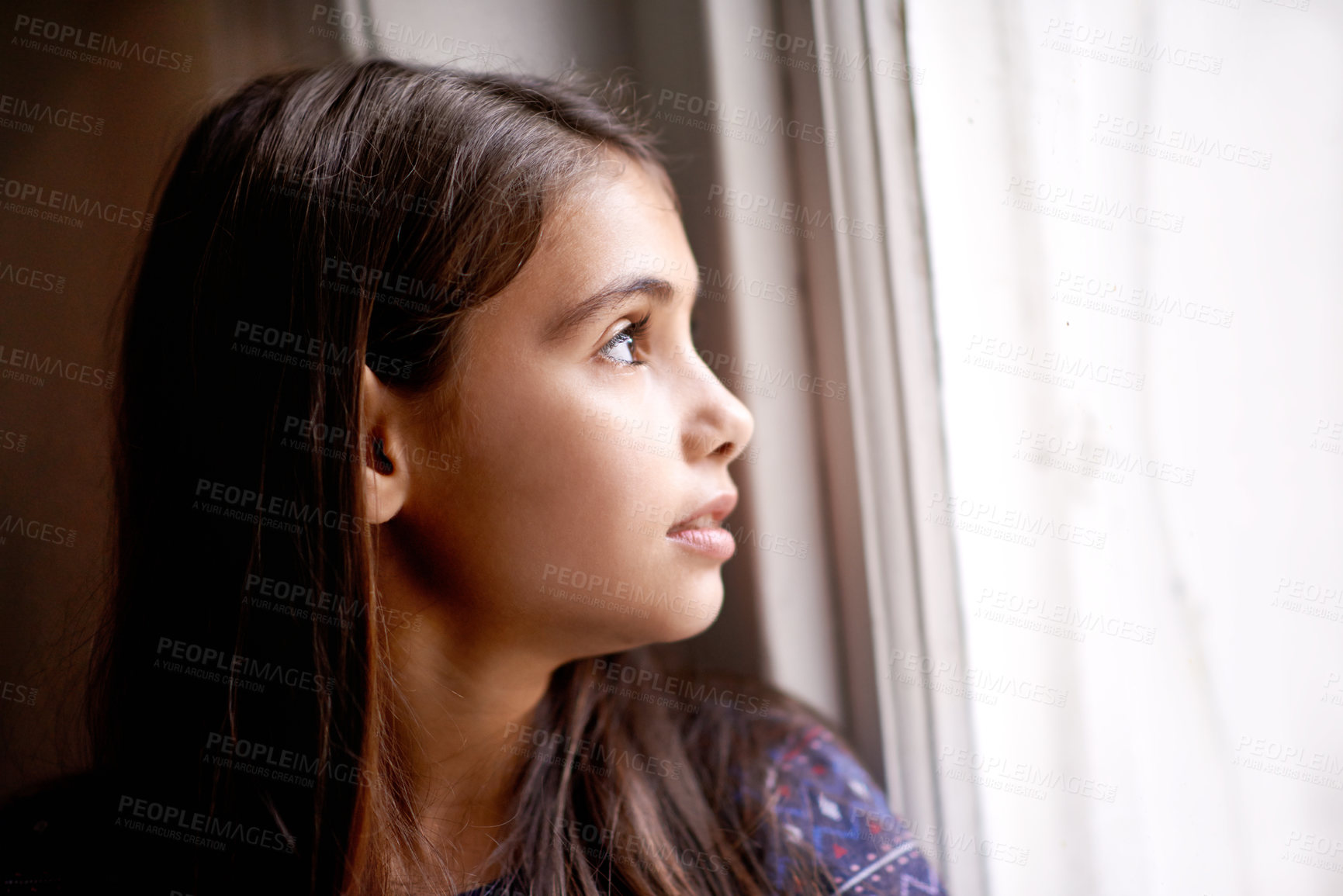 Buy stock photo Thinking, window and face of child in home for relaxing, rest and calm on weekend. Youth, ideas and face of young girl by glass for view, thoughtful and reflection for happiness, playing or childhood
