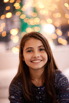 Buy stock photo Home, happy and portrait of child with lights for relaxing, resting and calm in bedroom at night. Youth, smile and face of young girl with fairy light for childhood memory, playing and happiness