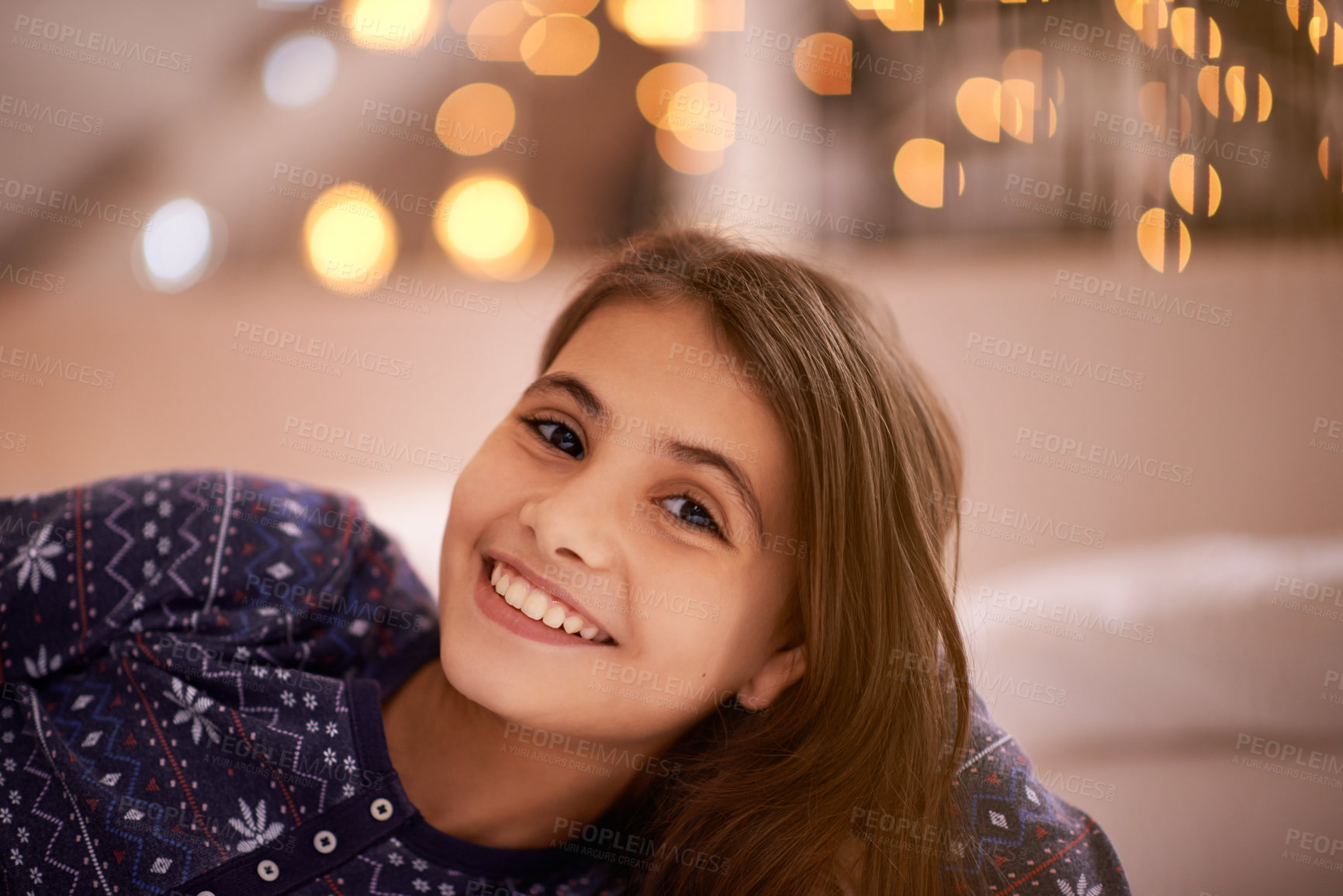 Buy stock photo Smile, happy and portrait of child with lights for relaxing, resting and calm in bedroom at night. Youth, home and face of young girl with fairy light for childhood memory, peaceful and happiness