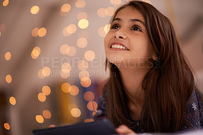 Buy stock photo Shot of a cute little girl using a digital tablet