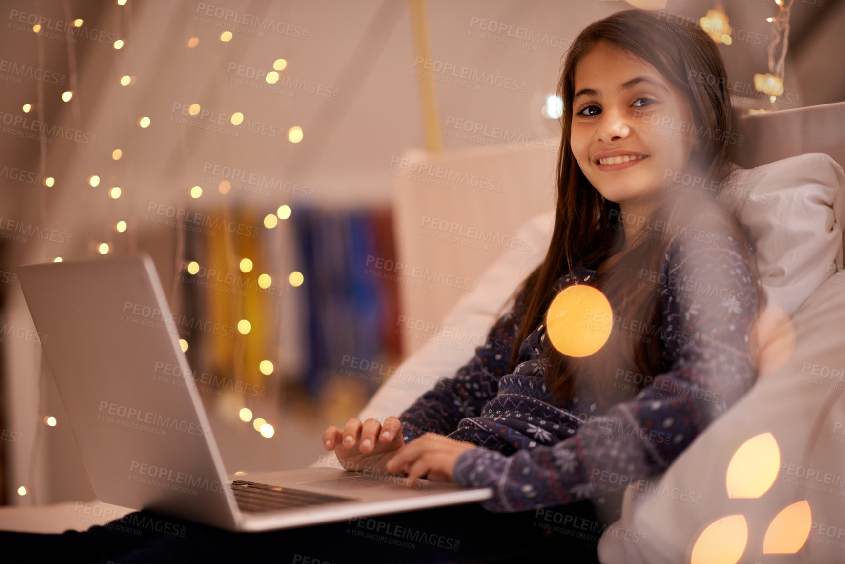 Buy stock photo Portrait, night or child with laptop for streaming, playing games and watching videos on a movie website. Smile, house or happy kid with technology to download online or social media app to relax