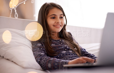 Buy stock photo Movies, night or kid with laptop for streaming, playing games and watching videos on a film website. Smile, house or happy female child with technology to download online or social media app to relax