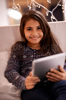 Buy stock photo Girl in portrait, kid and tablet, tech and communication with ebook for reading and social media at home. Elearning, movie or storytelling app with internet, browsing and digital platform for gaming