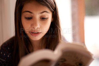 Buy stock photo Girl, kid and book for reading in home with thinking, learning and language with studying for growth. Child, literacy and ideas with story, novel and fantasy with education in family house in Madrid
