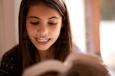 Buy stock photo Children, education and girl with a book in her home for reading, research or storytelling practice for class assignment. Learning, knowledge or kid school student with notebook, study or development