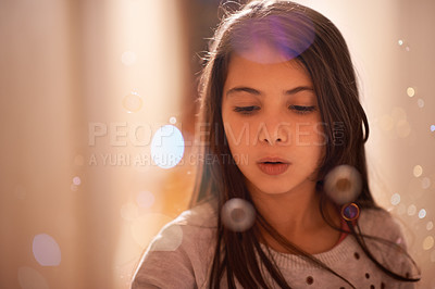 Buy stock photo Shot of a cute little girl blowing bubbles
