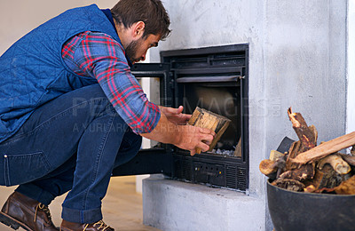 Buy stock photo Fireplace, hearth and man with wood for fire for heat, warmth and light in winter in home. Flame, burning and person with firewood or logs for comfortable, cozy and relaxing atmosphere in living room