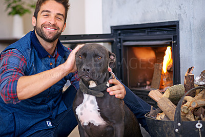 Buy stock photo Fireplace, dog and portrait of man in home with fire for heat, warmth and light in winter. Flame, wood and person with pet bonding with firewood for comfort, cozy and relaxing house in living room