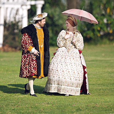 Buy stock photo Medieval, walking and couple in history with renaissance fashion outdoor with marriage and love. Vintage, garden and royal leader with queen together on a lawn with conversation and theater costume 