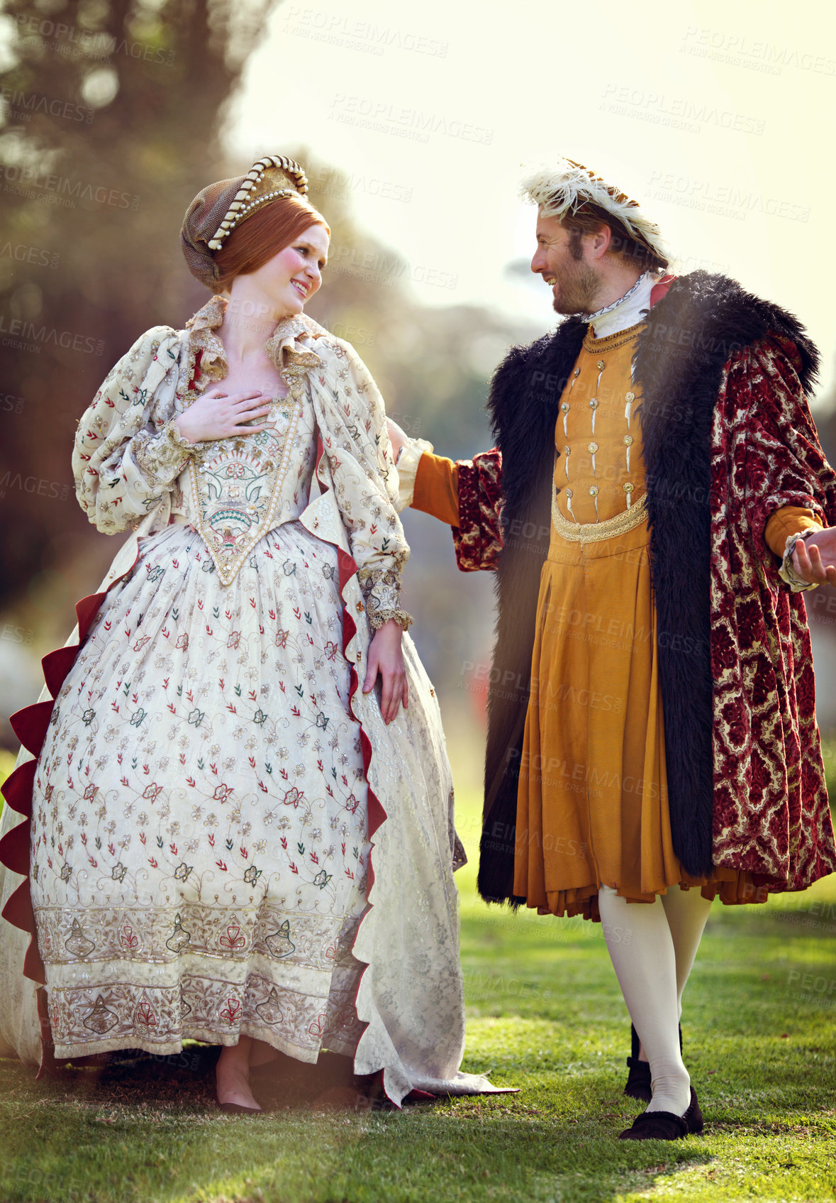 Buy stock photo Medieval, lawn and couple in history with renaissance fashion outdoor with marriage and love. Vintage, king and royal leader with queen together on a garden with conversation and theater costume 