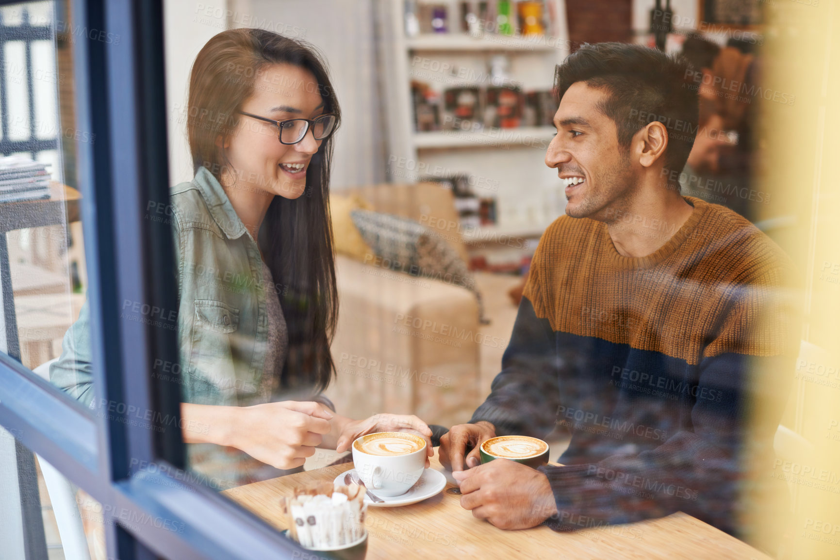 Buy stock photo Happy couple, relax and date with coffee at cafe for conversation, bonding or romance at indoor restaurant. Man and woman with smile by window and enjoying drink, beverage or morning caffeine at shop