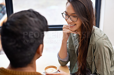 Buy stock photo Couple, date and coffee shop with happy conversation and talking together with hot drink in a cafe. Woman, smile and joy from discussion and chat in a restaurant with tea or cappuccino at a table 