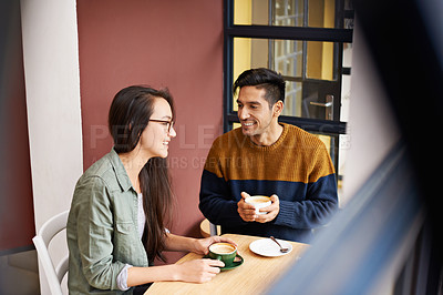 Buy stock photo Coffee shop, date and couple relax with drink in conversation, talking and chatting for bonding. Love, happy and man and woman with caffeine, cappuccino and beverage in restaurant, cafe and store