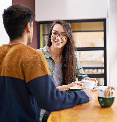 Buy stock photo Coffee shop, talking and couple on date with drink in conversation, discussion and chat for bonding. Love, happy and man and woman with caffeine, cappuccino or beverage in restaurant, cafe and store