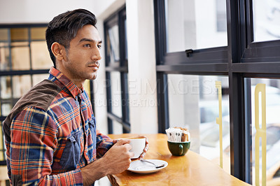 Buy stock photo A young man at a coffee shop