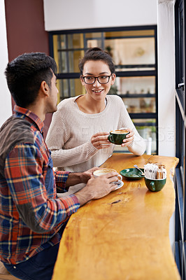 Buy stock photo Happy people, friends and relax with coffee for morning, breakfast or chatting together at indoor restaurant. Young man and woman with smile in happiness for social bonding or talking at cafe table