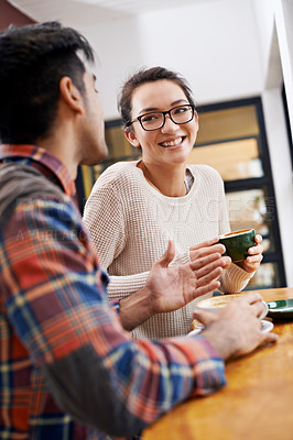 Buy stock photo Couple, date and coffee shop with conversation and talking together with hot drink in a cafe. Woman, smile and happy from discussion and chat in a restaurant with tea or cappuccino at a table 