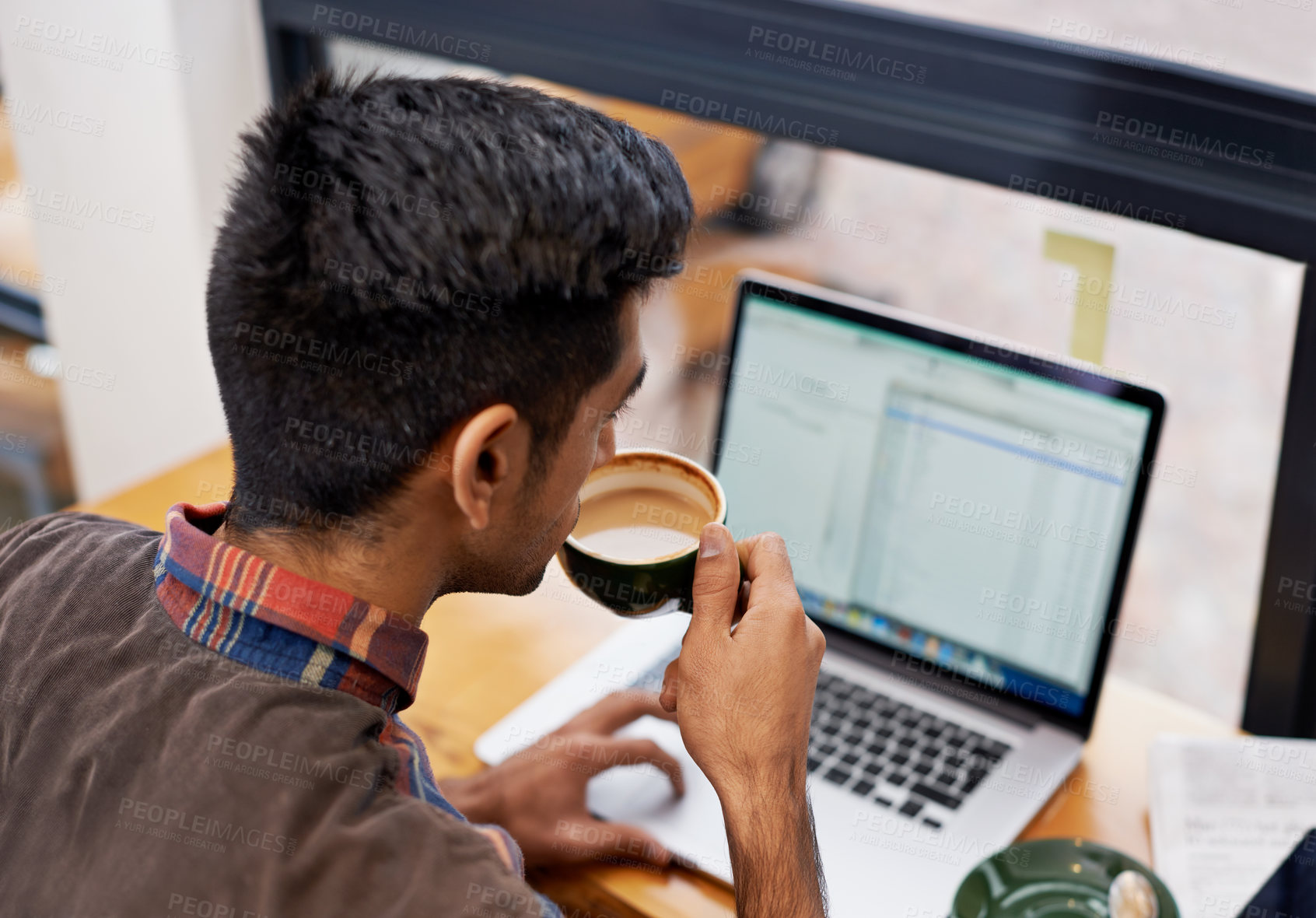 Buy stock photo Man drinking coffee while working with a laptop in a cafeteria doing research for remote work project. Technology, caffeine and male employee planning a creative report on a computer in restaurant.