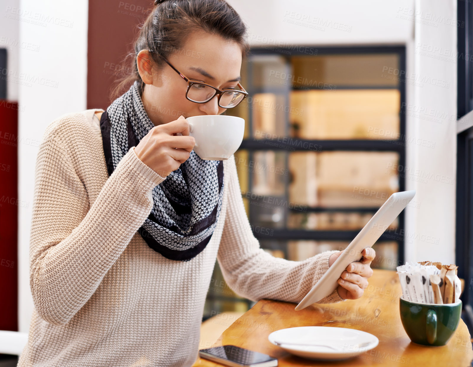 Buy stock photo Woman, drinking coffee and tablet in cafe with freelancer work and social media with cappuccino. Website, drink and internet with digital blog writer and technology at restaurant with tea and reading