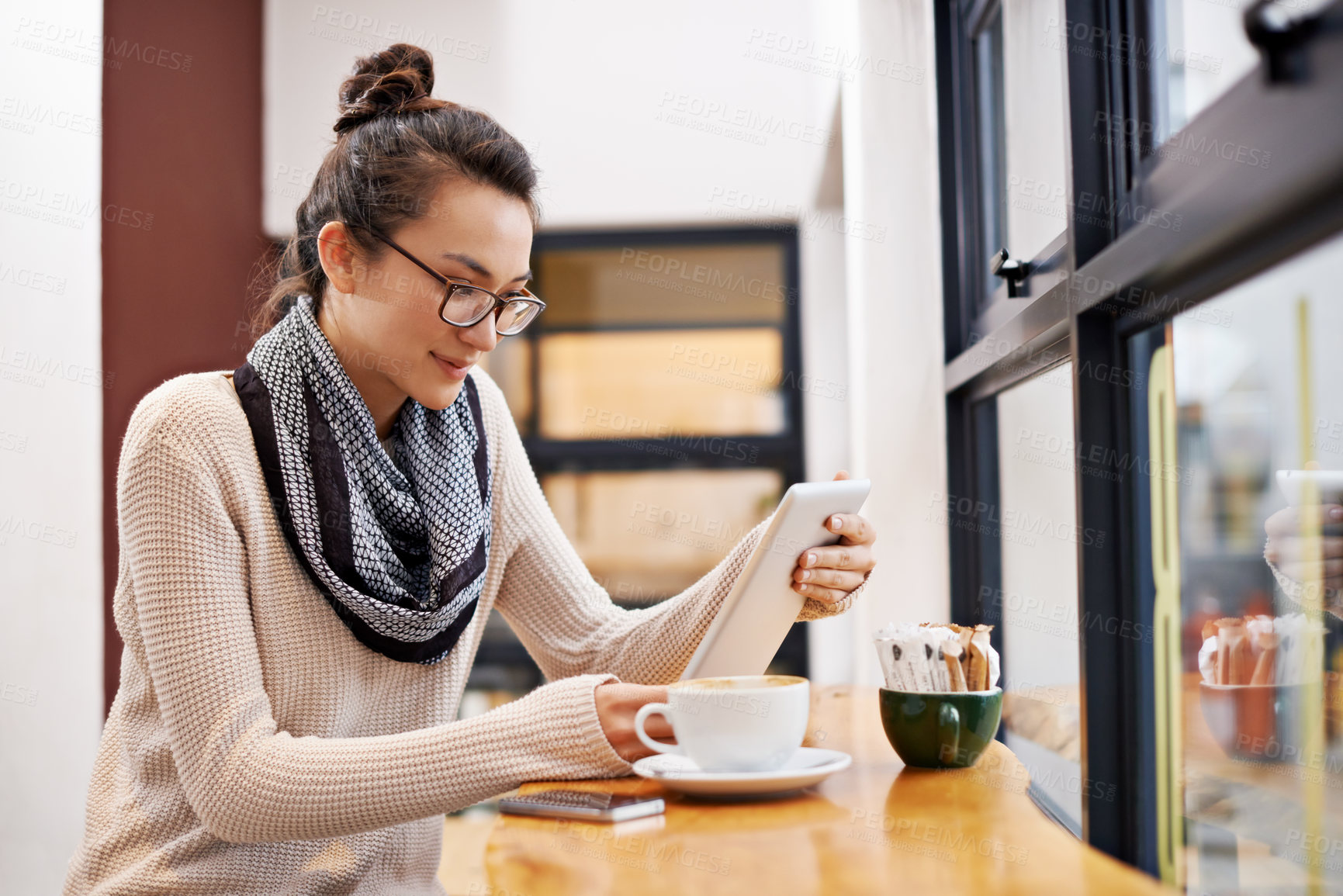 Buy stock photo Woman, coffee shop and tablet with freelancer work and social media in cafe with cappuccino. Website, hot drink and internet with digital blog writer and technology at restaurant with tea and reading