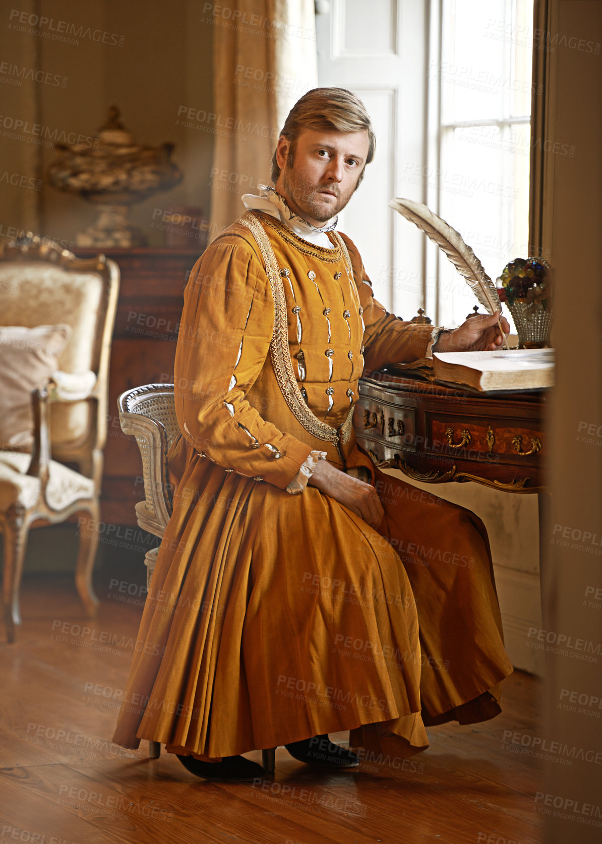 Buy stock photo Shot of an aristocratic man at his writing table