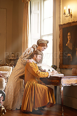Buy stock photo Couple, feather and writing a letter, renaissance and relax in home for history in noble palace. People, royalty and bonding or notes in journal for plan, love and aesthetic for support in marriage