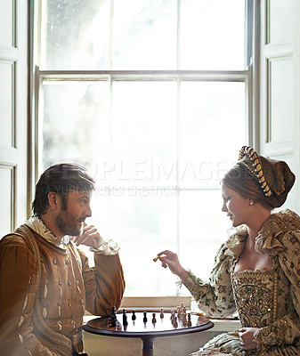 Buy stock photo Renaissance, couple and chess at home with talking, vintage and medieval costume in a palace. Window, luxury and queen together with smile from strategy game and talking while playing with love