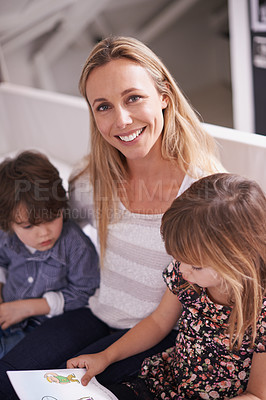 Buy stock photo Portrait, mother and children on sofa with book for bonding, teaching and learning together in home. Woman, son and daughter relax on couch with storytelling, smile and family reading in living room