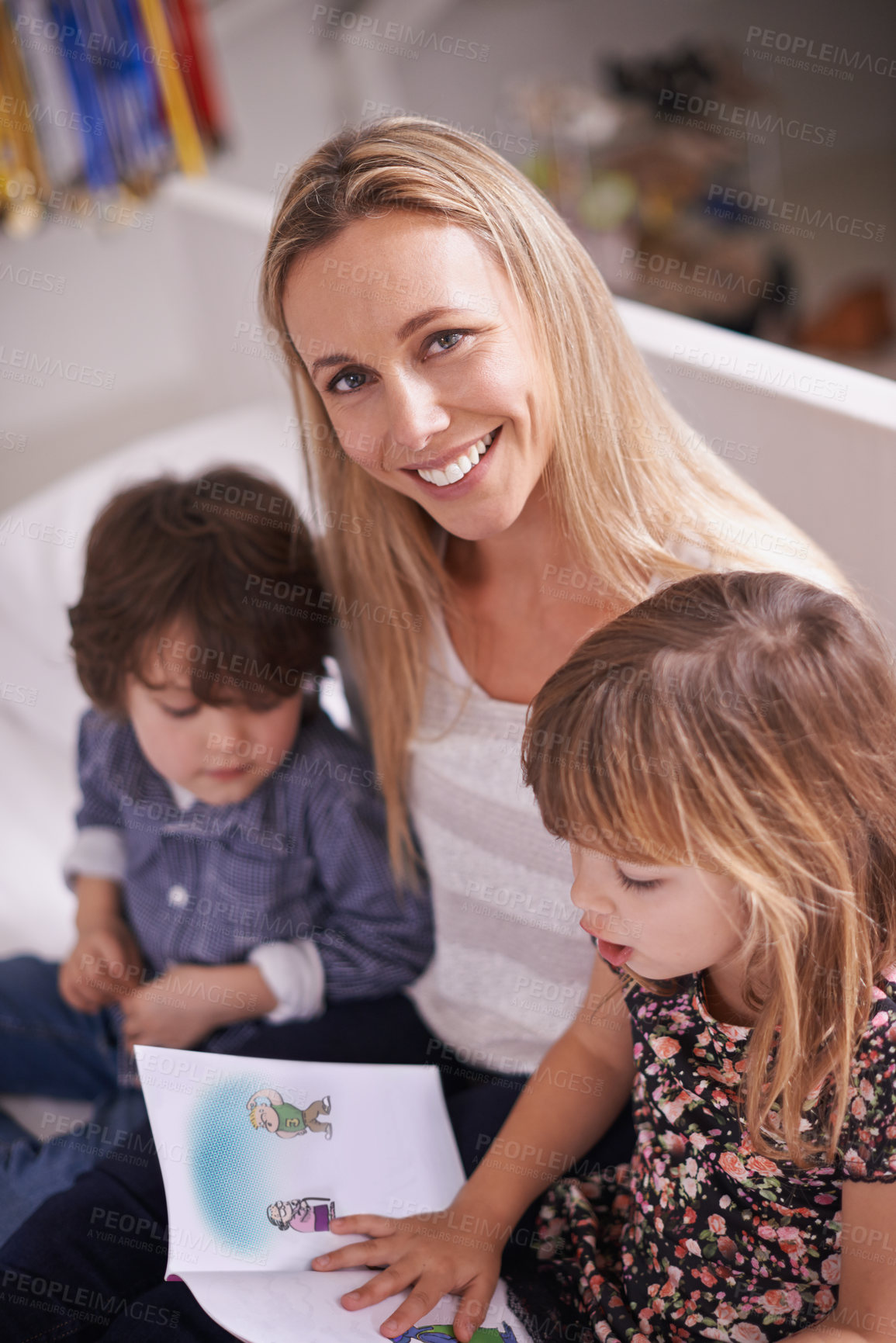 Buy stock photo Portrait, mother and kids on sofa with book for bonding, teaching and learning together in home. Mom, son and daughter relax on couch with storytelling, smile and happy family reading in living room