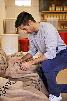 Buy stock photo Man, factory and check with bag for coffee beans, quality assurance or thinking with product for export. Entrepreneur, caffeine and trading with organic process, manufacturing or inspection for stock
