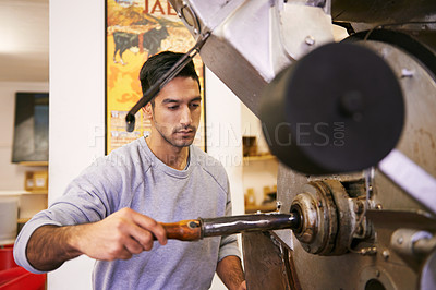 Buy stock photo Man, factory and machine for grinding coffee with roast, process and flavor for export in industry. Person, employee and tools for caffeine, beans or press with manufacturing at warehouse in Colombia
