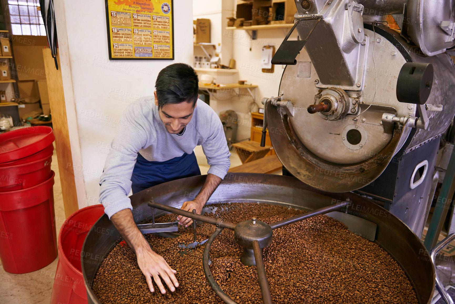 Buy stock photo Coffee beans, blend and man with machine for roasting with small business, production and quality control. Entrepreneur, barista or worker with grain at cafe, sustainable startup and espresso process