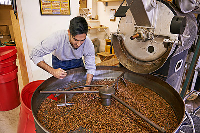 Buy stock photo Coffee, quality control and man with machine for roasting with blending, production and small business. Entrepreneur, barista or person with beans at cafe, sustainable startup and espresso process