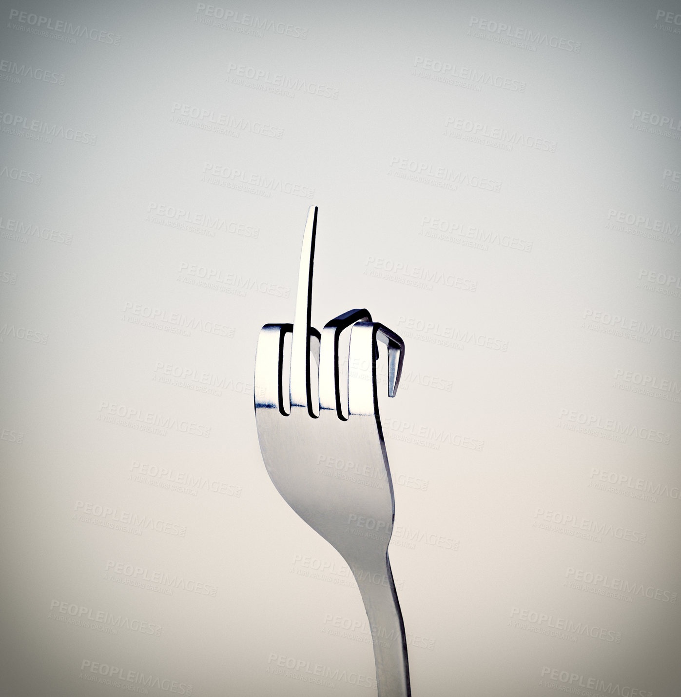 Buy stock photo A fork showing a rude gesture while isolated on grey