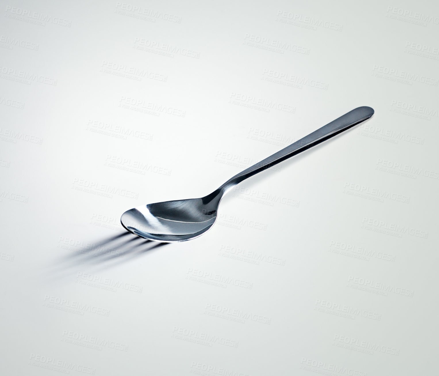 Buy stock photo Spoon, shadow and fork with mockup space, utensils and kitchen tool on a white studio background. Promotion, design and metal with artistic expression and bizarre with reflection, steel and mystery