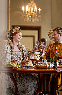 Buy stock photo Queen, king and people with toast, happy and wine together at dinner, celebration or party in royal mansion. Woman, man and smile with cheers, alcohol or drink with food for event in Victorian palace
