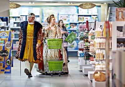 Buy stock photo A king and queen browsing in a supermarket