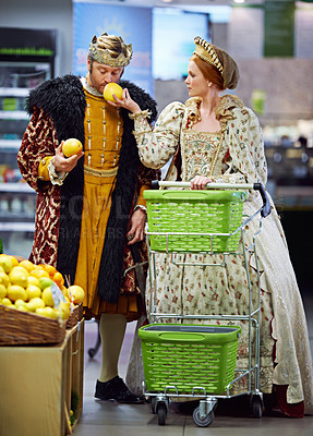 Buy stock photo Royal couple, supermarket and king with queen, conversation and shopping with increase. Smelling, store and man with woman and decision with inflation and choice with retail, groceries and product