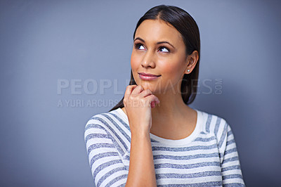 Buy stock photo Woman, thinking and smile for idea in studio, planning and happy for solution on blue background. Female person, brainstorming and contemplating a choice or decision, ponder and small business owner