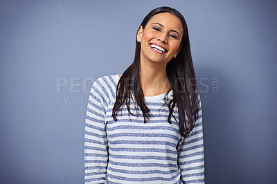 Buy stock photo Woman, happy and laugh in studio portrait for funny joke, humor and comedy on blue background. Female person, mockup space and smile for comic satisfaction, confidence and silly or goofy enjoyment